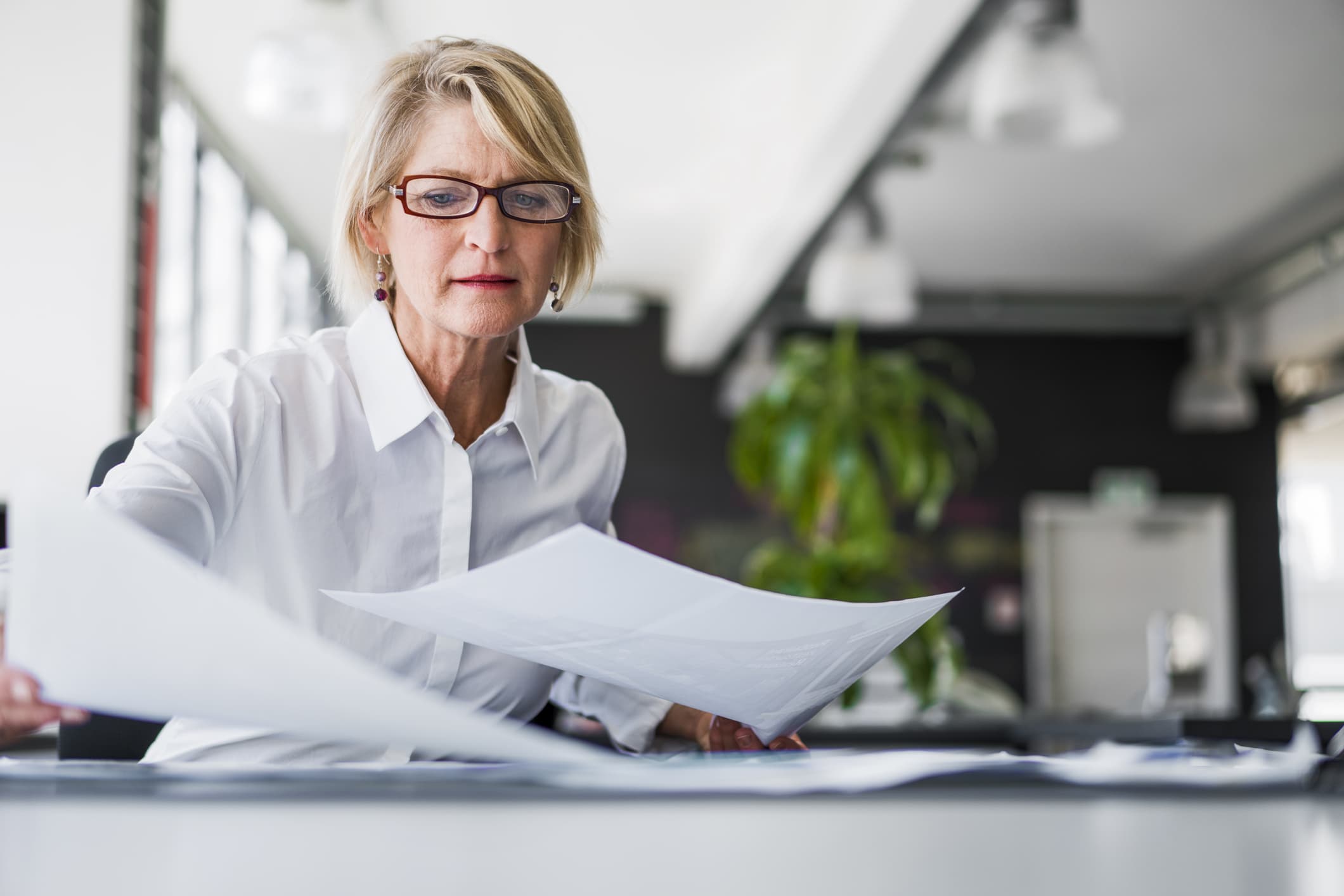 a woman working with paperwork